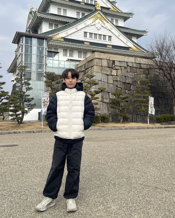 Owen standing in front of Osaka Castle.